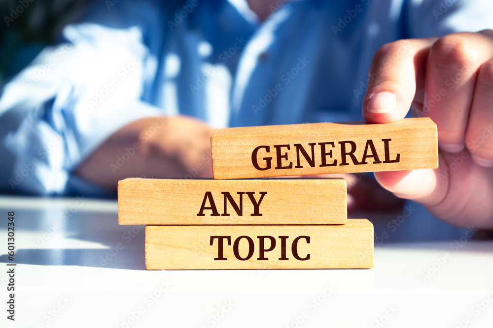 Close up on businessman holding a wooden block with Close up on businessman holding a wooden block with