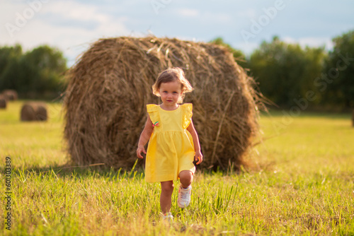 little girl in a yellow field