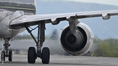 Huge airplane jet engine close up view moving forward heat haze distant airplane lining up behind. 4k super slow motion raw video 120 fps