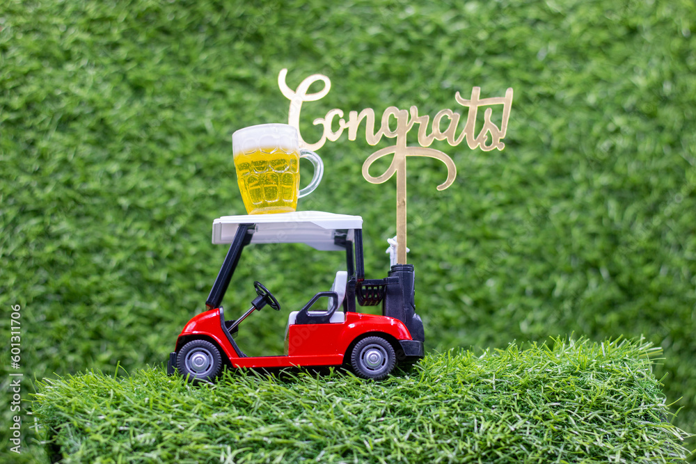 Golf Cart with Beer Congrats to golfer on green grass background Golf Cart with Beer Congrats to golfer on green grass background
