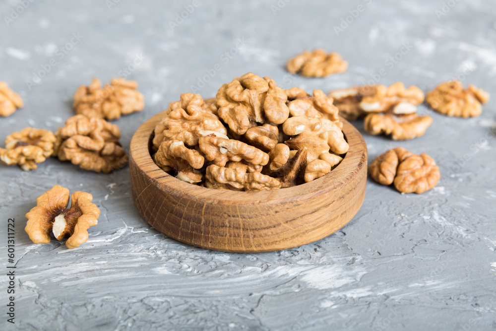 Fresh healthy walnuts in bowl on colored table background. Top view Healthy eating bertholletia concept. Super foods Fresh healthy walnuts in bowl on colored table background. Top view Healthy eating bertholletia concept. Super foods