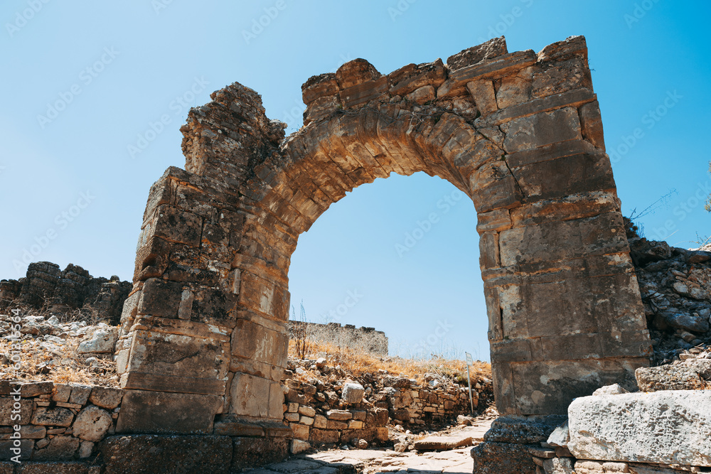 Aspendos, Antalya, Turkey: A captivating photo showcasing the stunning arches of the ancient city, demonstrating the remarkable architectural skill of the past.