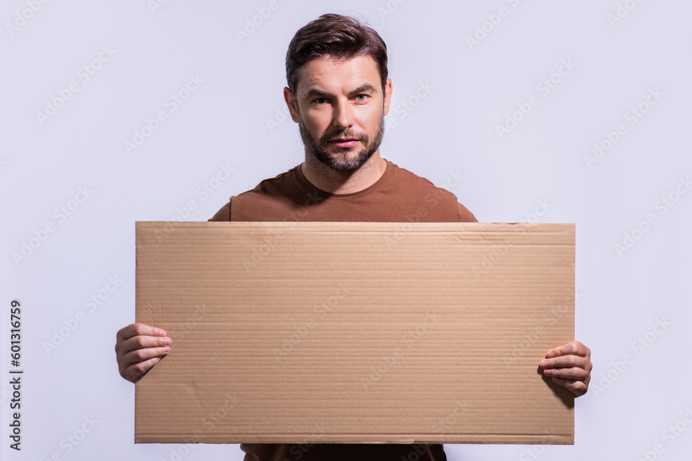 Man with empty blank board on studio background. Blank signboard with copy space. Advertisement concept. Ad board with copy space, blank mock up copy space. Blank signboard, placard with copy space. Man with empty blank board on studio background. Blank signboard with copy space. Advertisement concept. Ad board with copy space, blank mock up copy space. Blank signboard, placard with copy space.