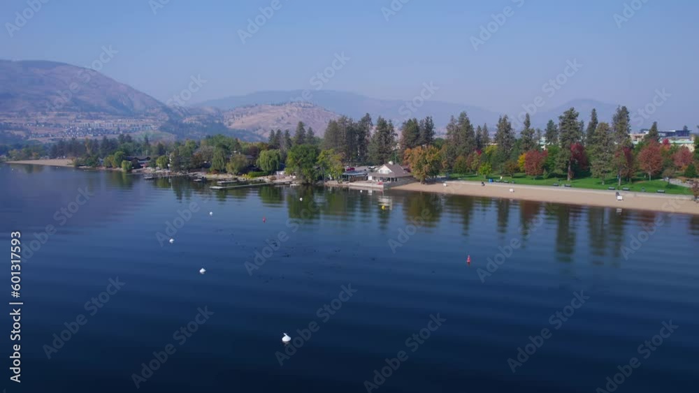 Drone flying over Lake Okanagan towards the beaches of Penticton. Drone flying over Lake Okanagan towards the beaches of Penticton.