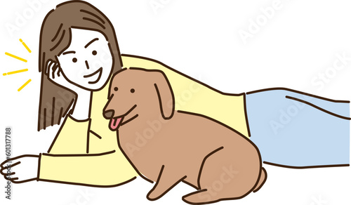 愛犬と寝転ぶ若い女性
