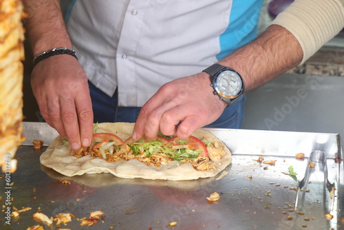 Konya, Turkey - May 30, 2023: Chef preparing and making Traditional Turkish Doner Kebab meat. Shawarma or gyros, fast food in Konya.