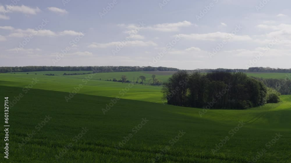 Shadows of clouds roll across the fertile green fields Shadows of clouds roll across the fertile green fields