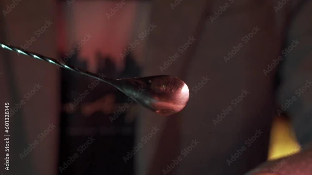 Bartender Drops Alcohol From Spoon in Slow Motion After Making Fancy Cocktail Bartender Drops Alcohol From Spoon in Slow Motion After Making Fancy Cocktail