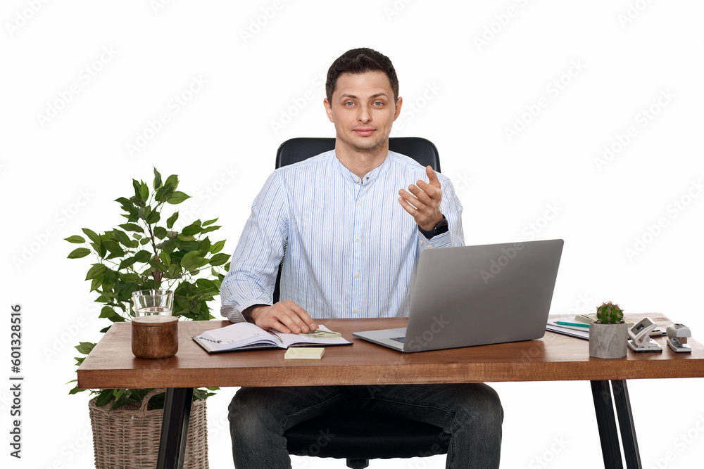 young man using laptop computer for online work at table young man using laptop computer for online work at table