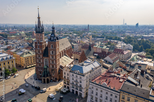 Saint Mary's Basilica in Kraków (Kościół Mariacki), Poland - Brick Gothic church on the Main Market Square - drone aerial photo on sunny day
