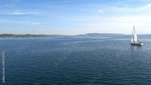 Lake Constance on a German flag excursion boat and blue water with sailing boats