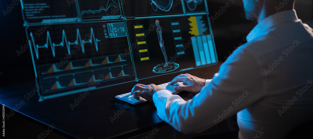 Caucasian man sits in the dark in front of a virtual menu. Close-up of male hands on the keyboard. - obrazy, fototapety, plakaty 