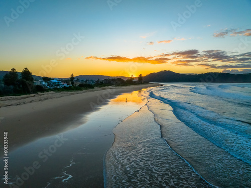 Sunrise at the seaside with gentle surf