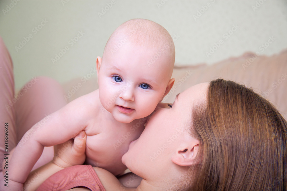 Young mother and her six months old baby boy. Young mother and her six months old baby boy.