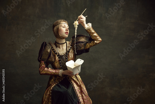 Portrait of young girl, royal person, princess in vintage dress eating noodles with chopsticks against dark green background. Concept of history, renaissance art remake, comparison of eras