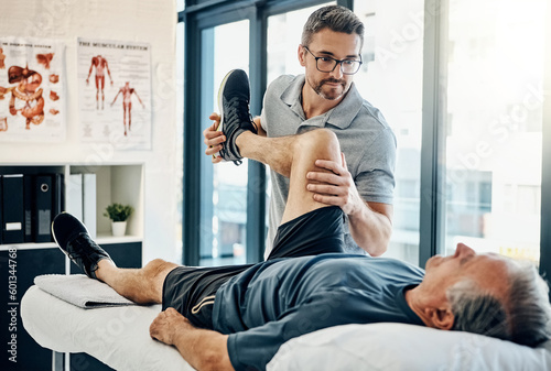 Stretching legs, rehabilitation and a physiotherapist with a man for wellness and disability support. Help, health and a male doctor helping an elderly person with physiotherapy on body muscle photo