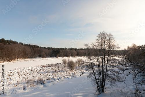 covered with ice and snow river in winter during frosts