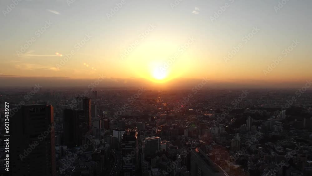 TOKYO, JAPAN : Aerial high angle sunset view of CITYSCAPE of TOKYO. Buildings and street around Shibuya station. Japanese urban city life, metropolis and travel concept. Time lapse shot, dusk to night TOKYO, JAPAN : Aerial high angle sunset view of CITYSCAPE of TOKYO. Buildings and street around Shibuya station. Japanese urban city life, metropolis and travel concept. Time lapse shot, dusk to night