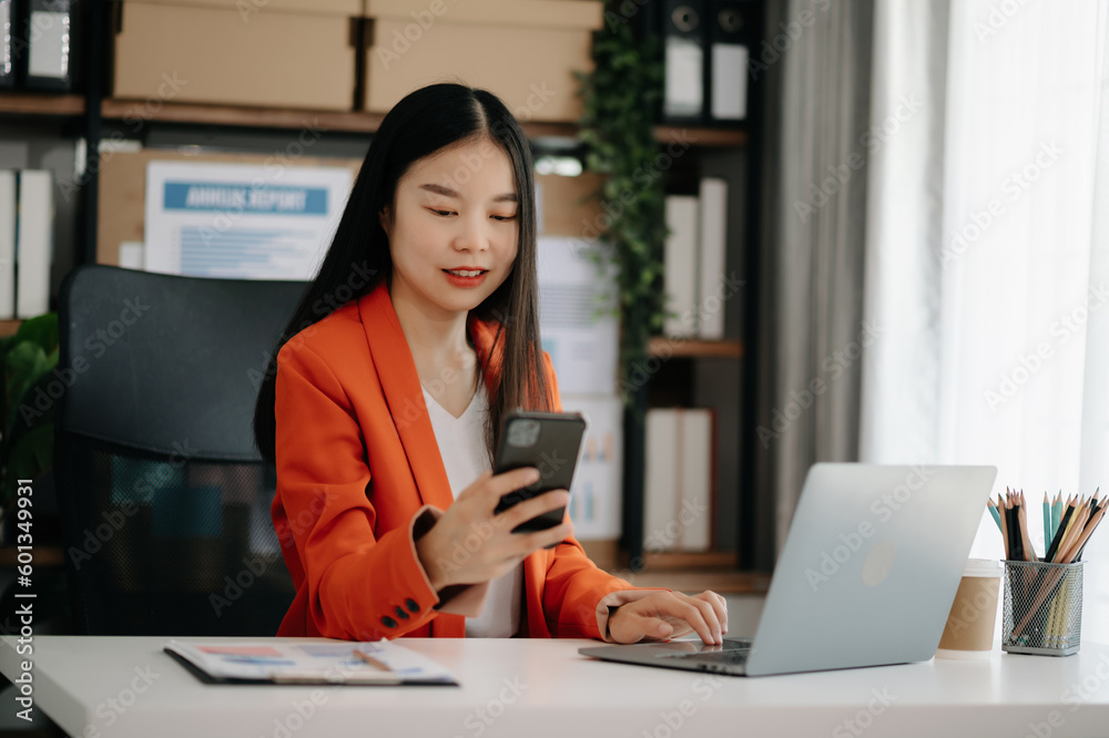 Business woman using tablet and laptop for doing math finance on an office desk, tax, report, accounting, statistics, and analytical research concept Business woman using tablet and laptop for doing math finance on an office desk, tax, report, accounting, statistics, and analytical research concept