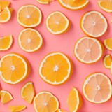 Numerous slices of oranges and lemons in a stylish, hot pink pattern. Generative AI.