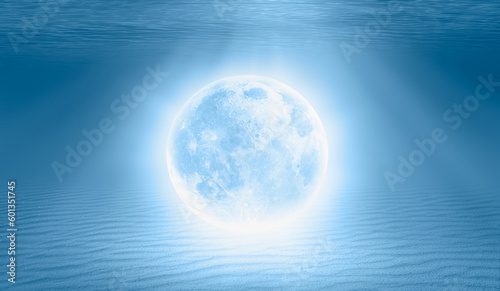 Full moon under water on the blue tropical beach  Elements of this image furnished by NASA 