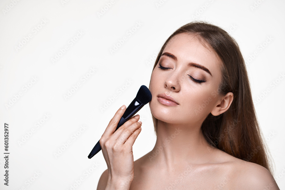 lovely lady posing with make-up brush for powder lovely lady posing with make-up brush for powder
