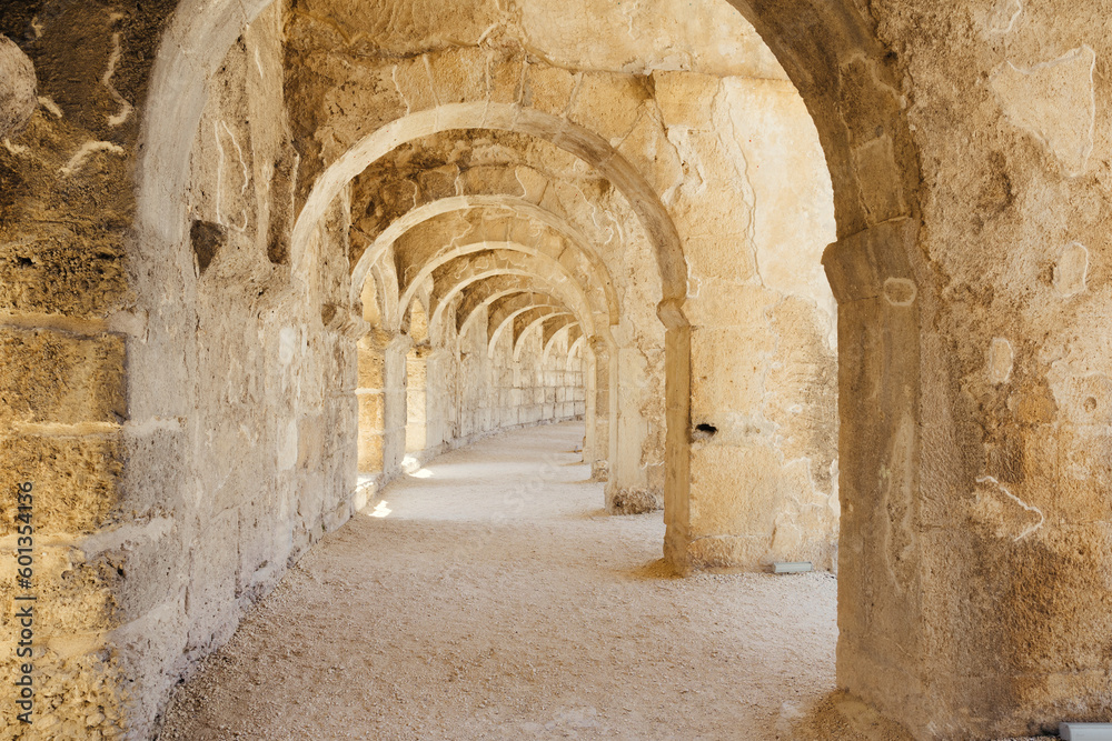 A photo of the upper balcony walkway and arches in Aspendos ancient theater, emphasizing its architectural beauty and scale.