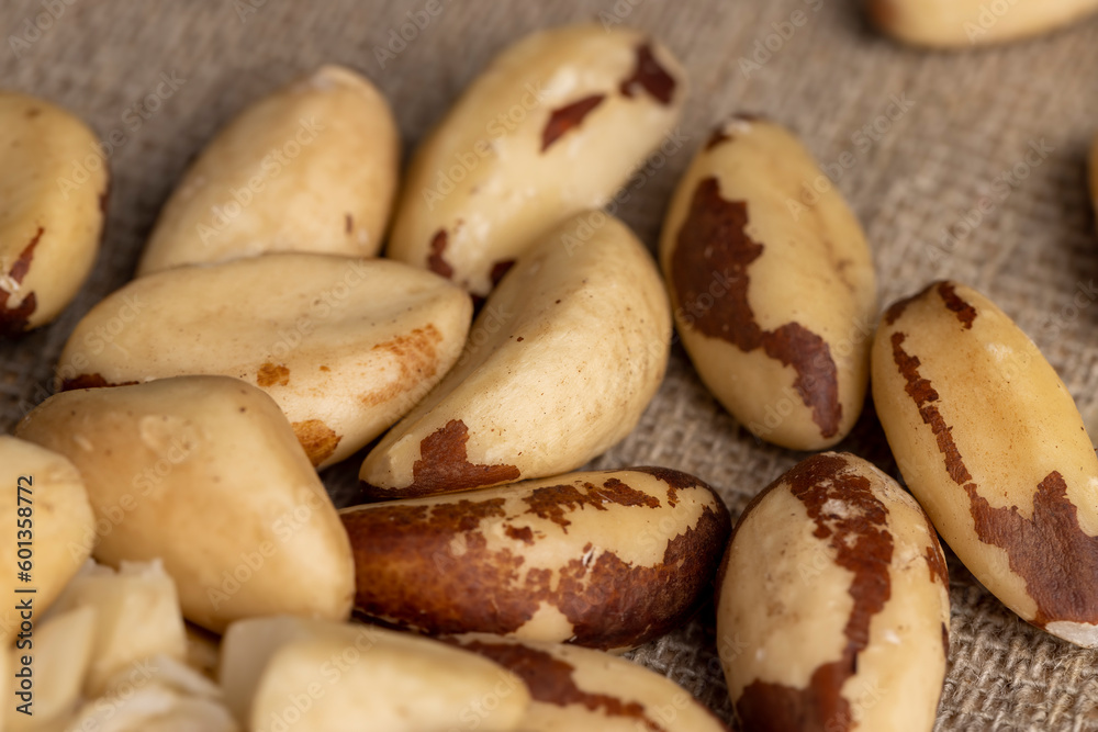 Obraz premium Brazil nuts peeled from the shell on the table