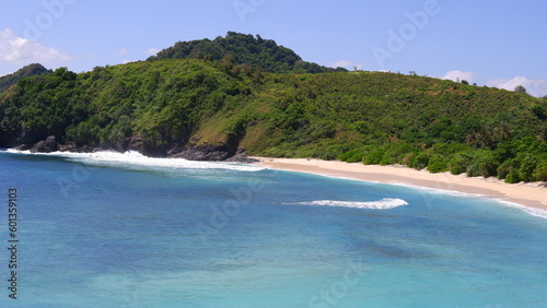 beautiful and enchanting view of Lombok's Mandalika beach with white sand and calm blue waves