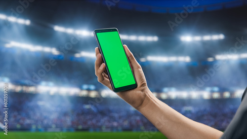 Photography Sport Stadium Championship: Person's Hand Holding Green-Screen Chroma Key Smartphone