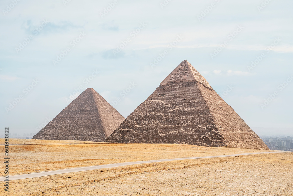 archaeological complex of Great Egyptian Pyramids is located on the Giza plateau, in the Libyan desert, on the left bank of the Nile. Pyramids of Chephren Khafra and Cheops Khufu. Vertical photo archaeological complex of Great Egyptian Pyramids is located on the Giza plateau, in the Libyan desert, on the left bank of the Nile. Pyramids of Chephren Khafra and Cheops Khufu. Vertical photo