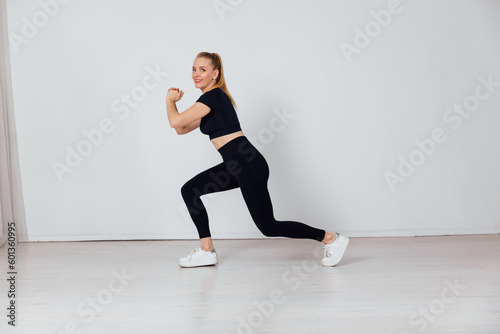 woman engaged in sports warm-up exercise gym