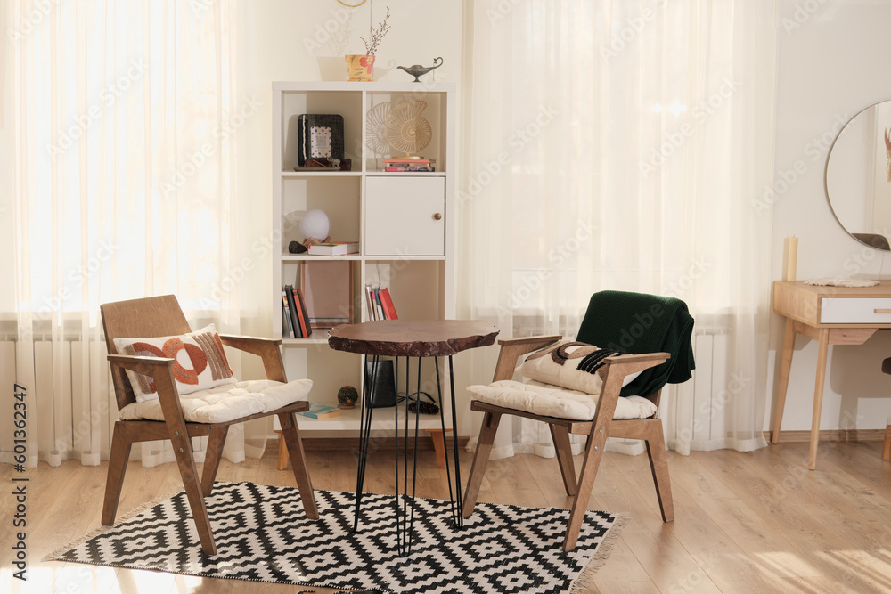 part of contemporary living room interior. modern light and airy aesthetic design. wooden furniture, natural coton rag. comfortable place. part of contemporary living room interior. modern light and airy aesthetic design. wooden furniture, natural coton rag. comfortable place.