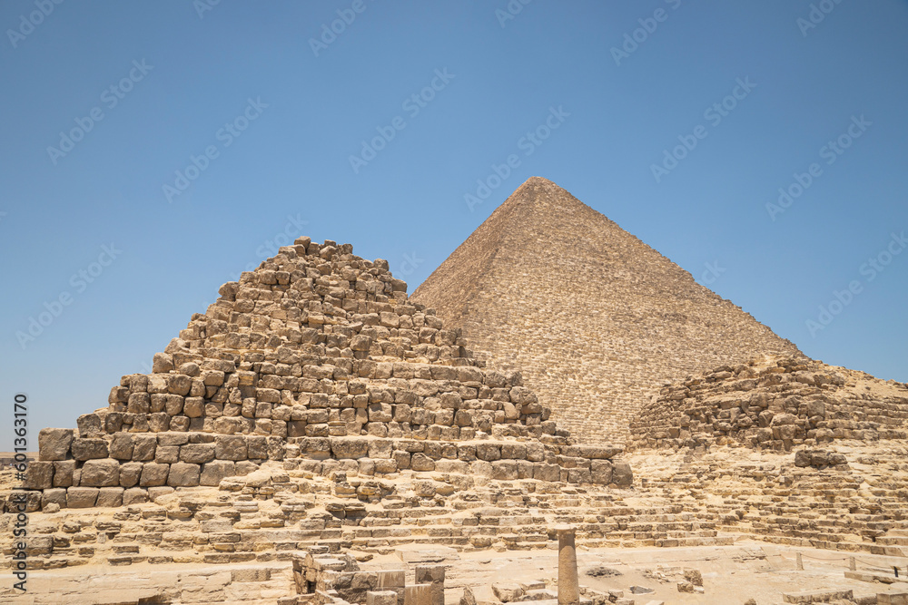 Image of great pyramid of Giza. Cairo, Egypt. In the foreground is a and small pyramids of priests. pyramids of the queens of giza Image of great pyramid of Giza. Cairo, Egypt. In the foreground is a and small pyramids of priests. pyramids of the queens of giza