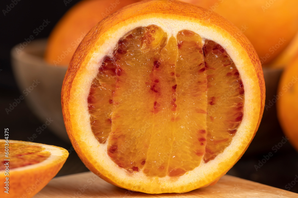 sliced orange with yellow-red juicy flesh