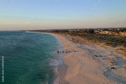 An aerial view of the coastline near sunset