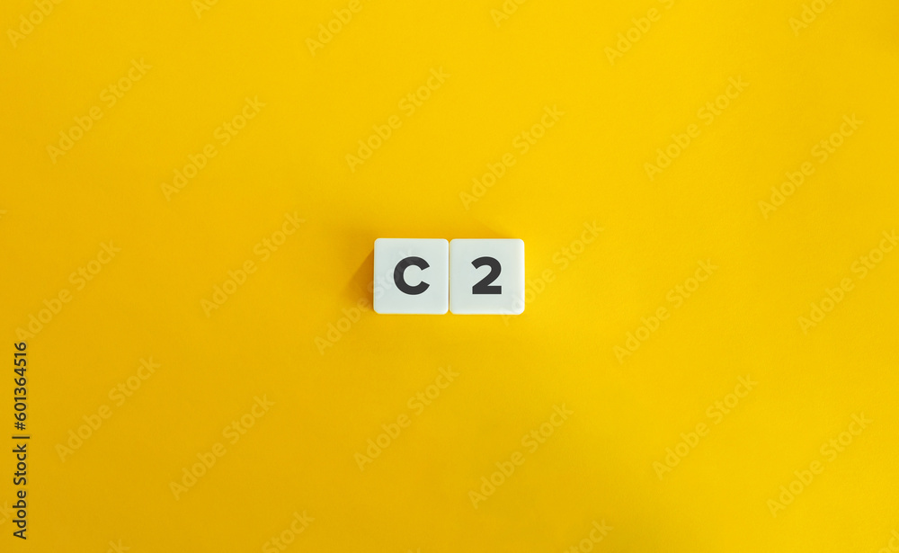 C2 level of language proficiency. Block Letter Tiles on Yellow Background. Minimal Aesthetics. C2 level of language proficiency. Block Letter Tiles on Yellow Background. Minimal Aesthetics.