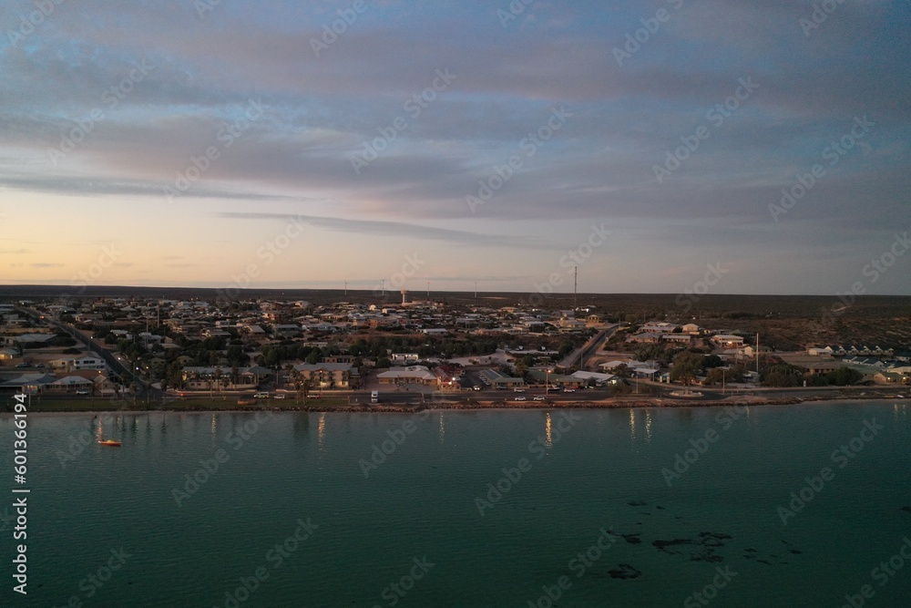An aerial view of the coastline near sunset