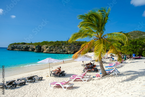 Grote Knip Beach Curacao Island March 2021  Tropical beach on the Caribbean island of Curacao Caribbean with tourist sunbathing under umbrellas at beach chairs on the beach