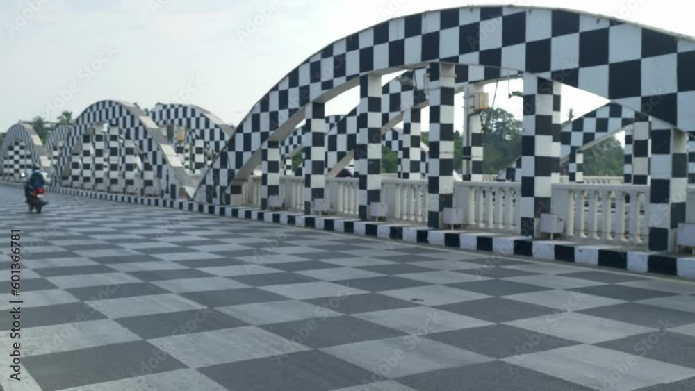 Cinematic shot of moving traffic at Napier Bridge transformed into a chessboard, Chennai, India