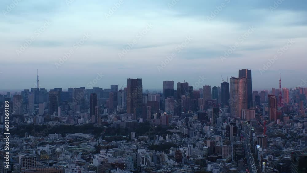 TOKYO, JAPAN : Aerial high angle sunset CITYSCAPE of TOKYO. View of buildings around Roppongi from Shibuya. Time lapse shot, dusk to night. Japanese urban city life and metropolis concept video. TOKYO, JAPAN : Aerial high angle sunset CITYSCAPE of TOKYO. View of buildings around Roppongi from Shibuya. Time lapse shot, dusk to night. Japanese urban city life and metropolis concept video.