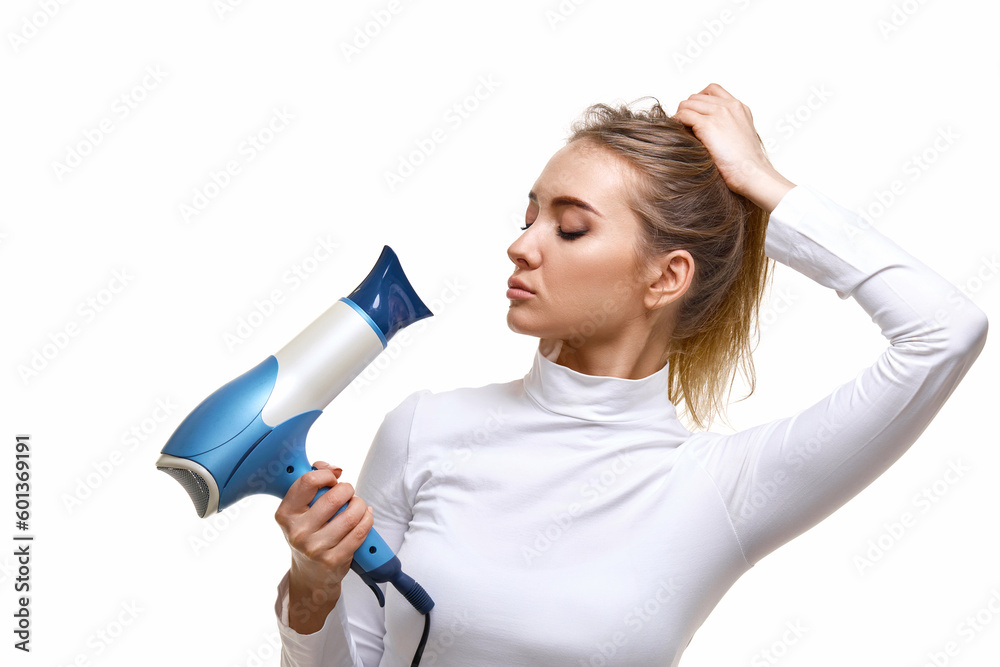 Portrait of attractive cheerful girl drying long hair Portrait of attractive cheerful girl drying long hair