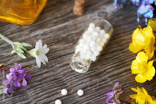 A bottle of homeopathic pills on a table