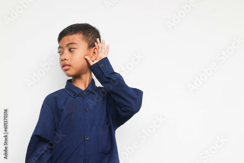 Kid in blue shirt listening something