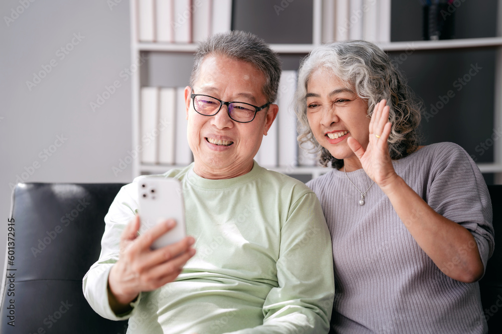 Senior couple use smartphone to video conference and greeting wi Senior couple use smartphone to video conference and greeting wi