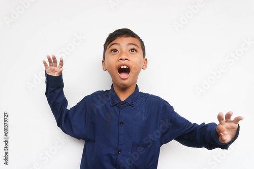 Photography Surprised boy wearing a blue casual shirt Isolated on white background