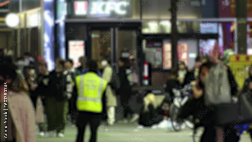 SHINJUKU, TOKYO, JAPAN - APRIL 2023 : KABUKICHO, TOYOKO area at night. TOYOKO KIDS (Group of young people, living around Kabukicho after been kicked out or driven from their homes) at the street. SHINJUKU, TOKYO, JAPAN - APRIL 2023 : KABUKICHO, TOYOKO area at night. TOYOKO KIDS (Group of young people, living around Kabukicho after been kicked out or driven from their homes) at the street.