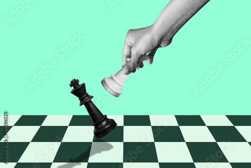 hand of businessman moving chess figure