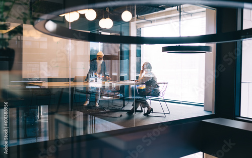 Elderly businesspeople working at meeting table in office