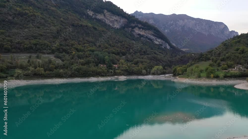 Rounded island on turquoise lake in Italy Rounded island on turquoise lake in Italy